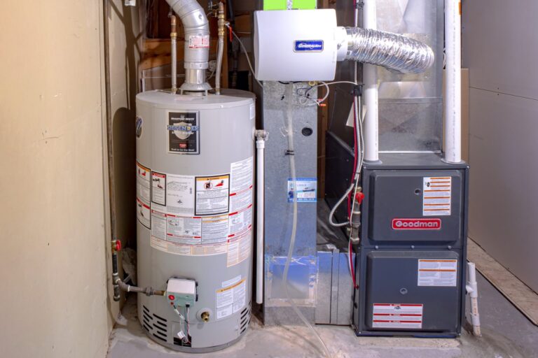 how long do hot water heaters last, hot water heater leaking from top